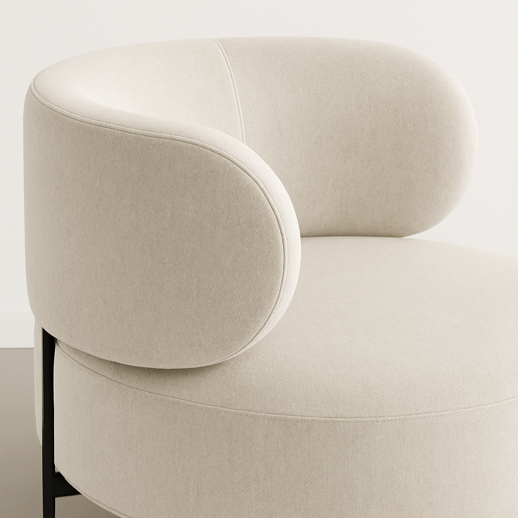 Beige armchair with black legs on a plain background